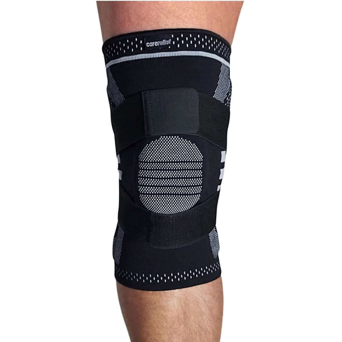 Elastisk knæbandage med skinner, gel patella, silikone kant og elastisk knæstrop. Støttebind til knæ med skinner og kompression i sort, str. s. m, l, xl. KN15 PRO Carerelief